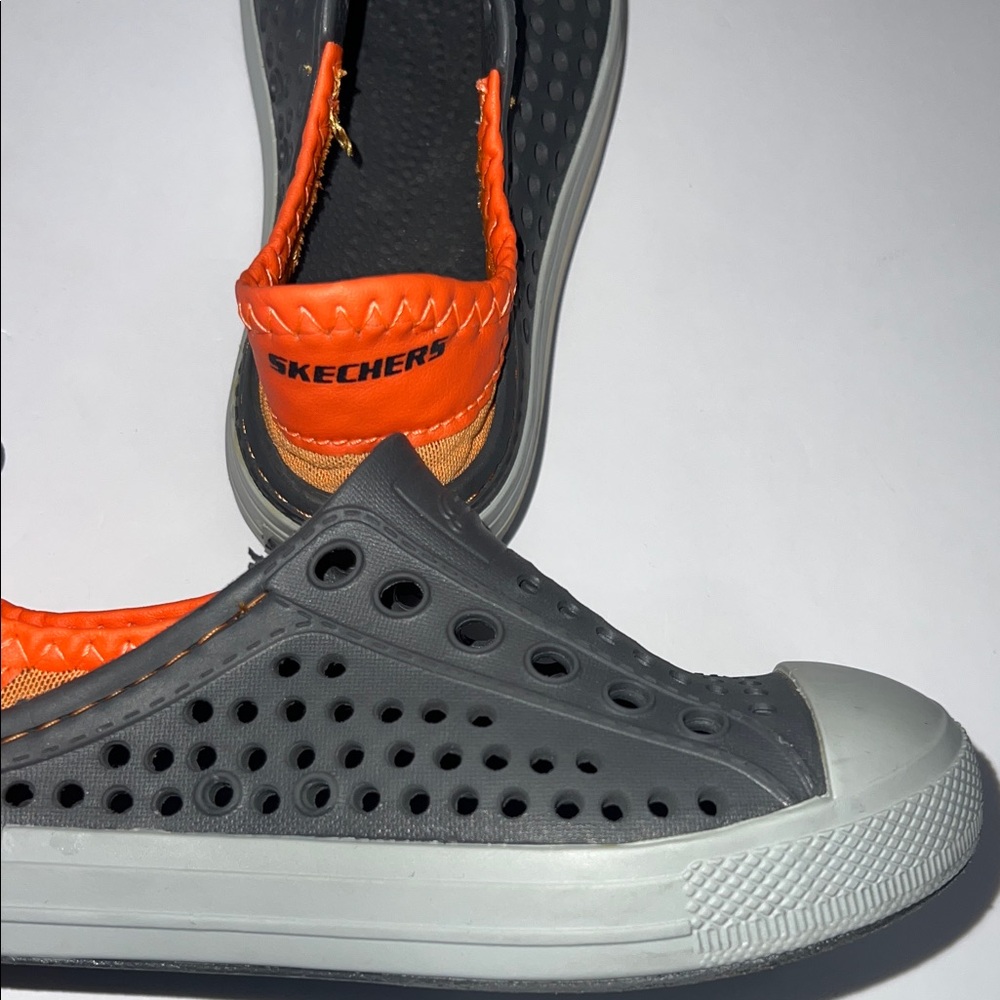 Skechers Kids Black and Orange Slip-On Sneakers - Picture 4 of 10